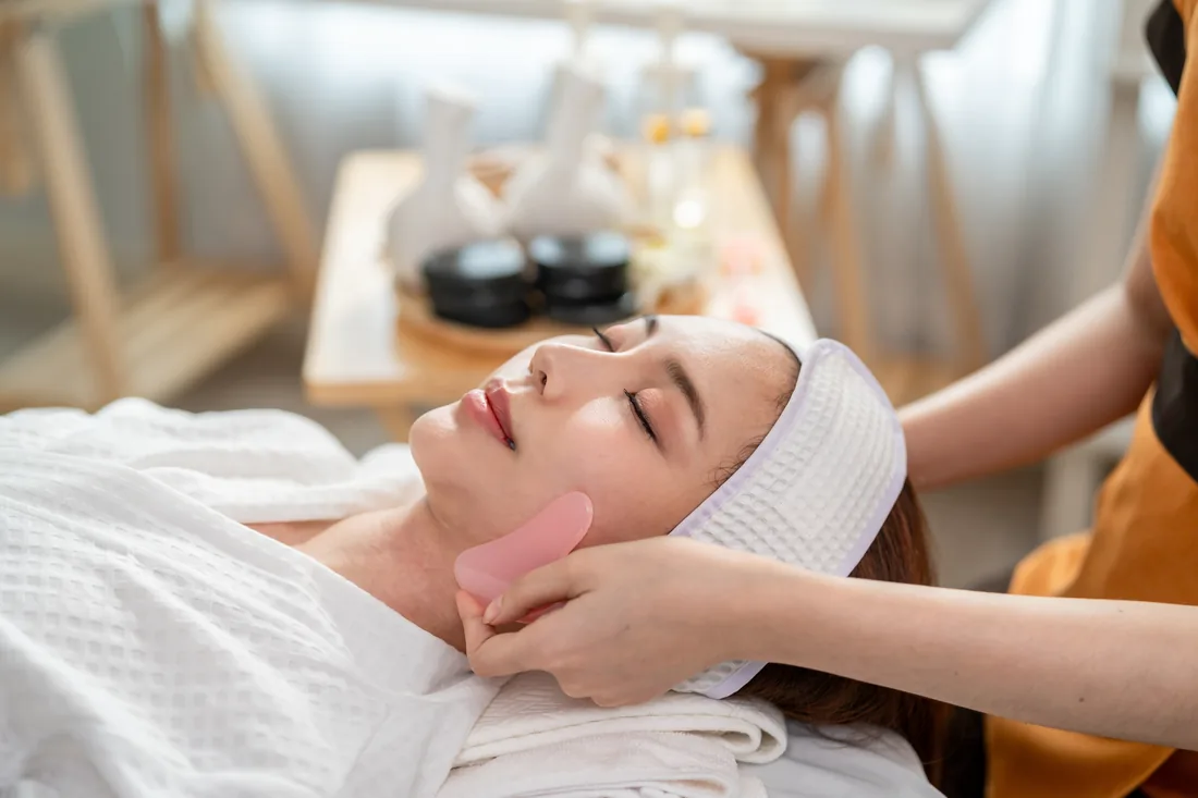 Client relaxing during a facial massage