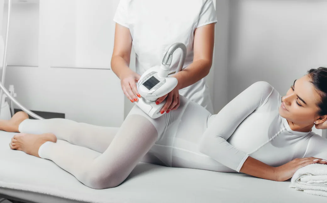 Therapist performing a body treatment on the legs