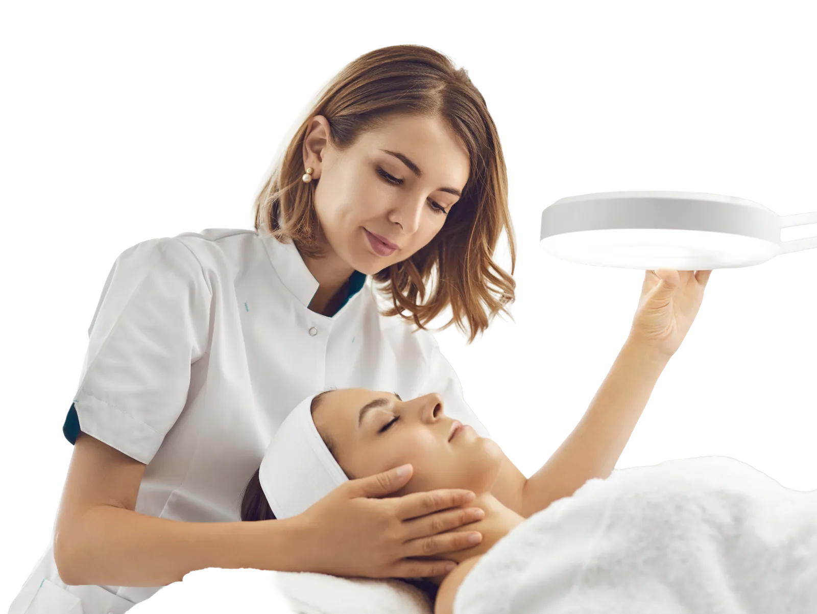 Therapist performing a facial treatment on a relaxed client